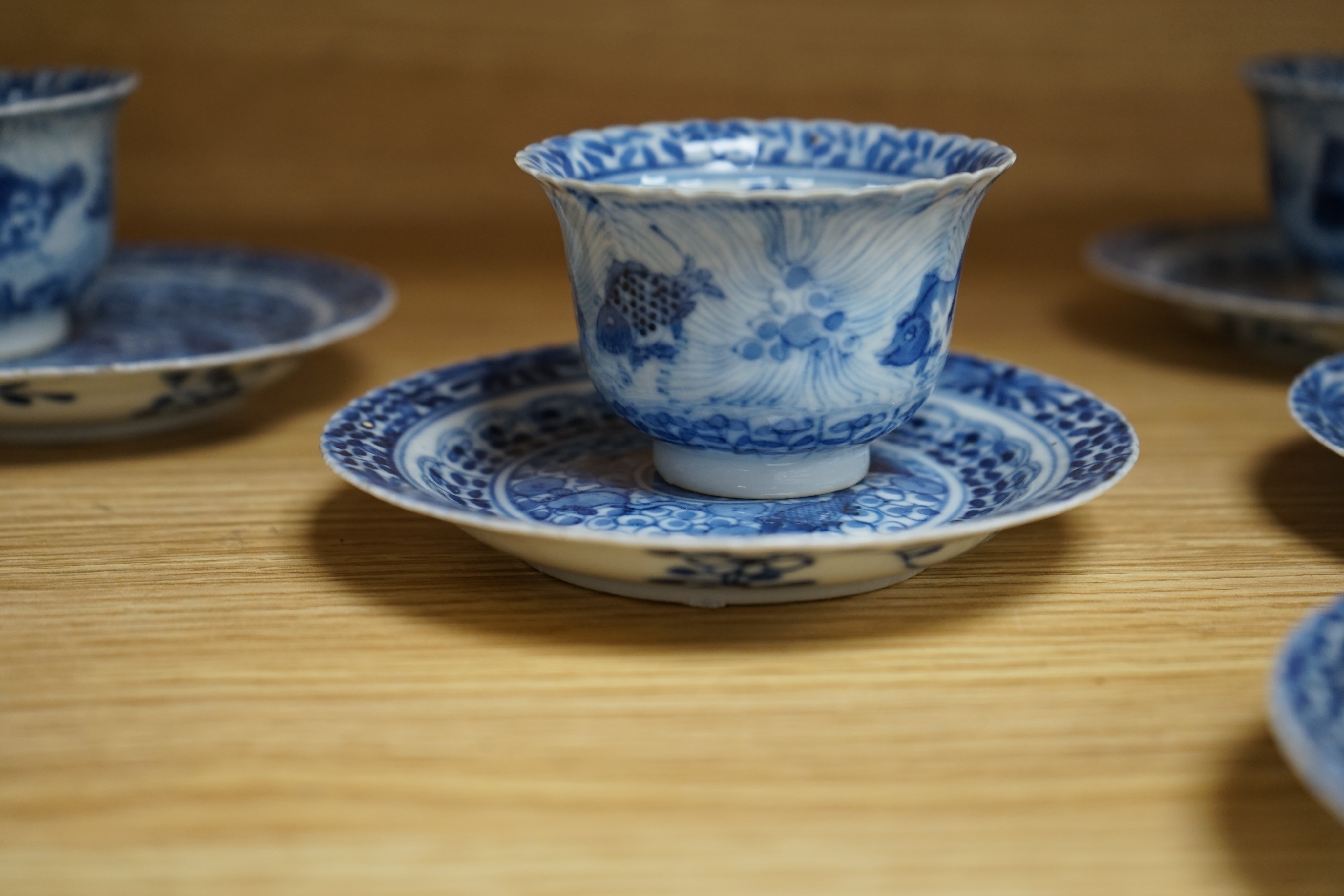 Five 19th century Chinese blue and white tea bowls and saucers, four-character marks to bases